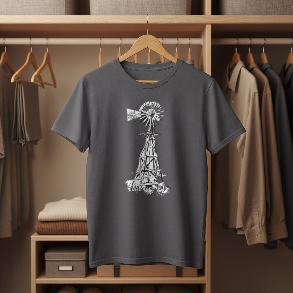 Gray t-shirt with a windmill design hanging in a wardrobe.