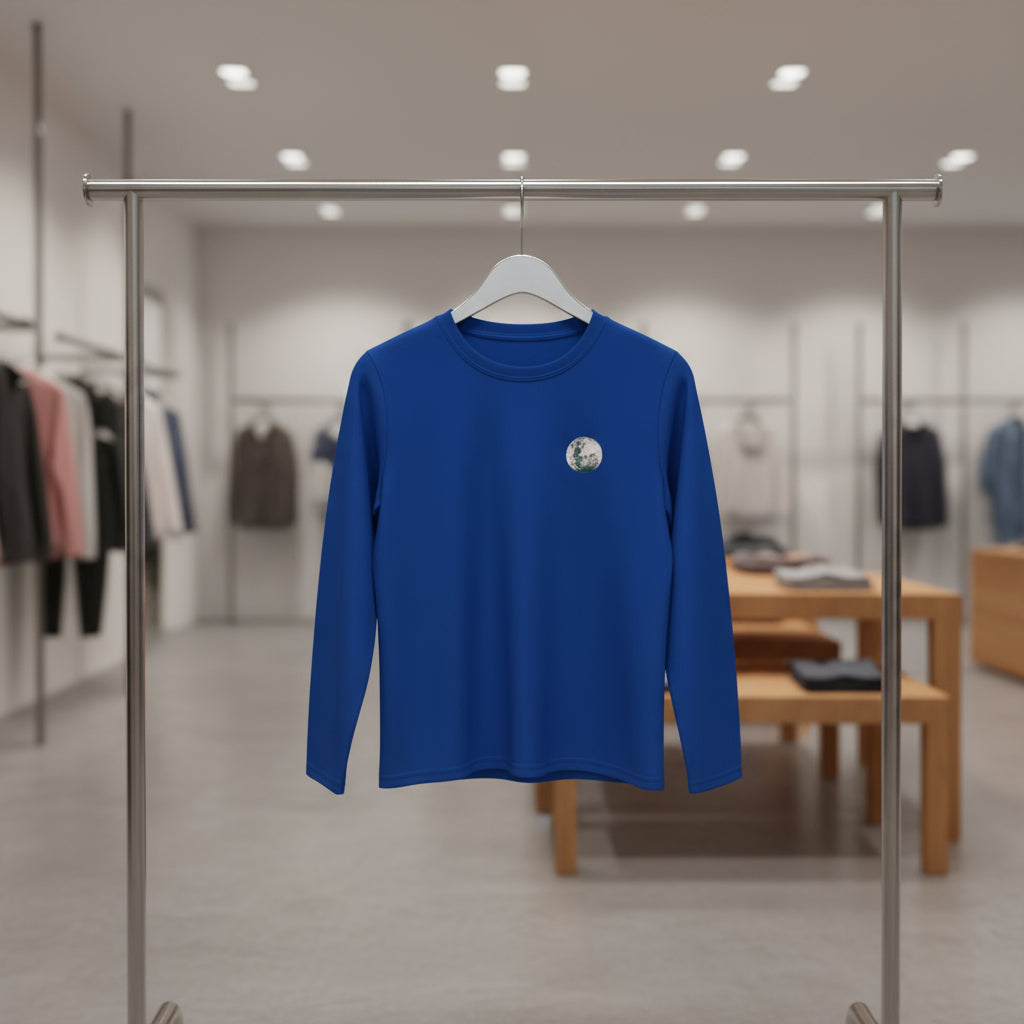 Blue long-sleeve shirt with a small graphic on the chest against a white background