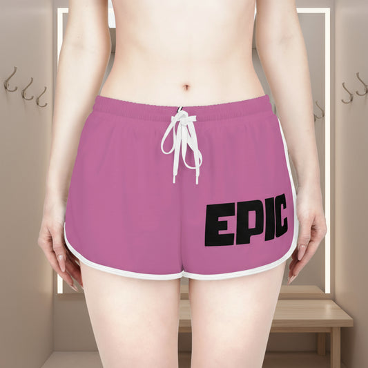 Purple shorts with 'EPIC' text worn by a person indoors.