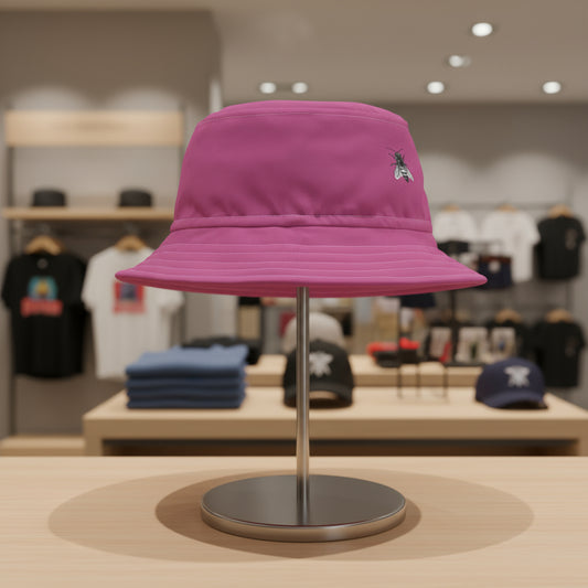 Pink bucket hat with a small embroidered design on a white background