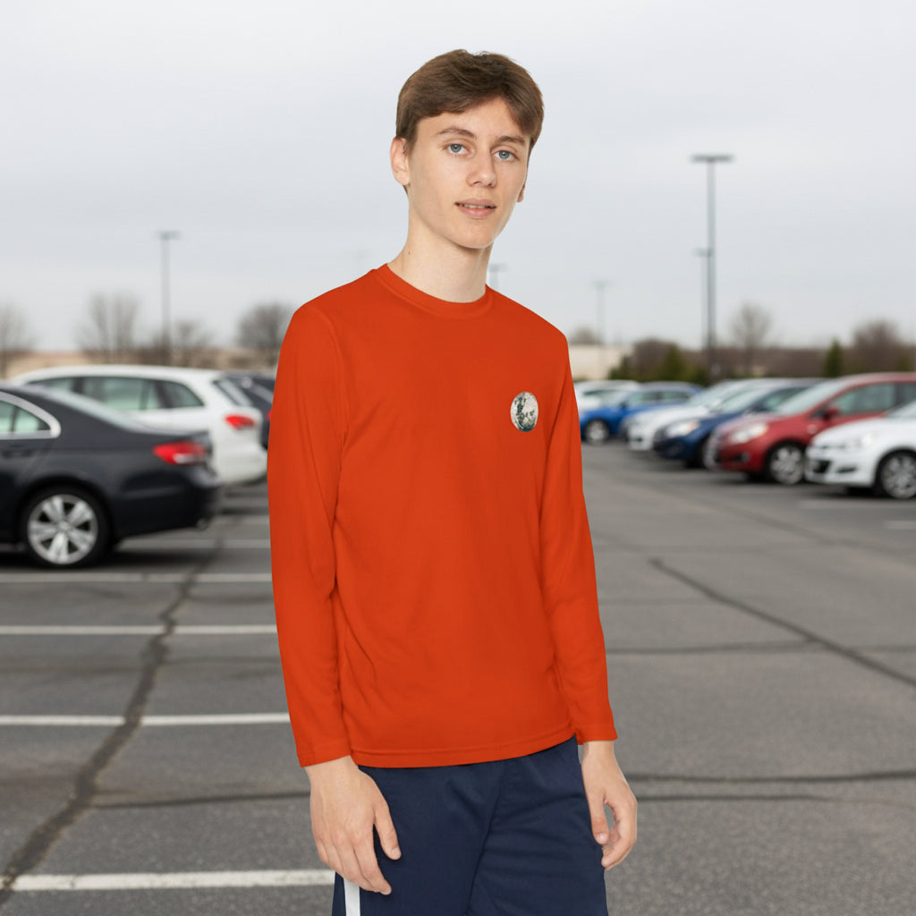 Person wearing an orange long-sleeve shirt with a logo on a white background