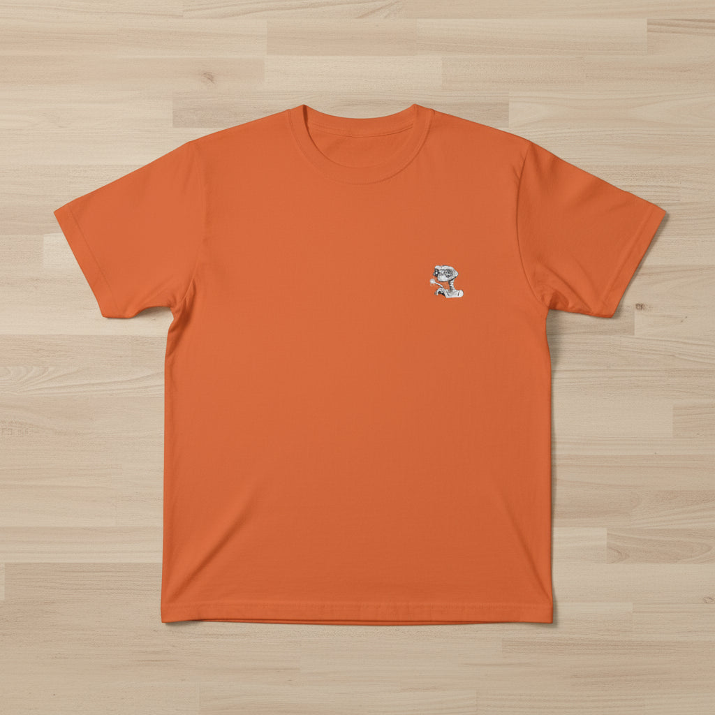 Folded orange t-shirt with a small logo on a white background