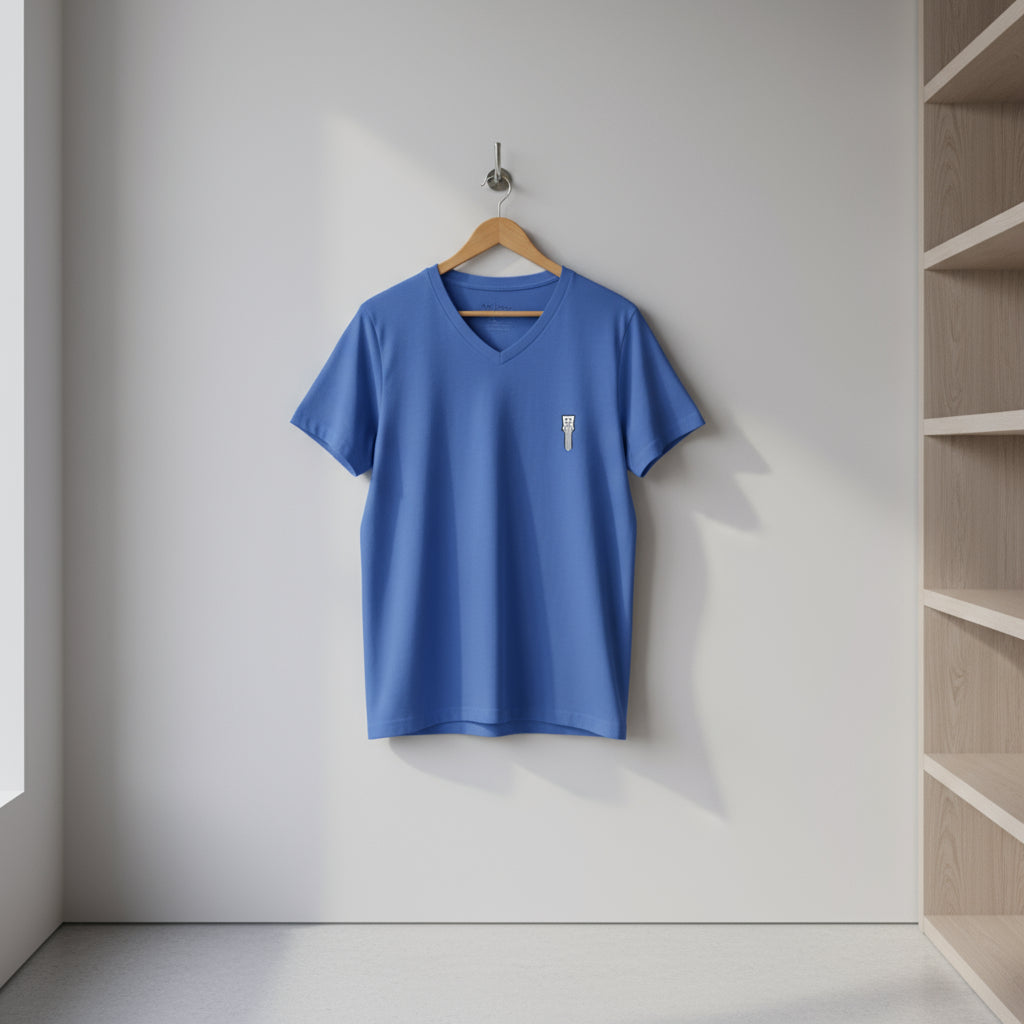 Blue t-shirt with a small white logo on a white background