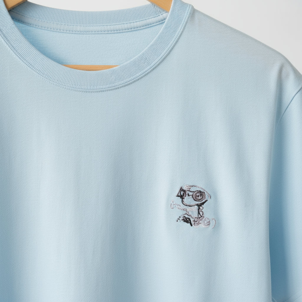 Light blue t-shirt with a small graphic on a white background