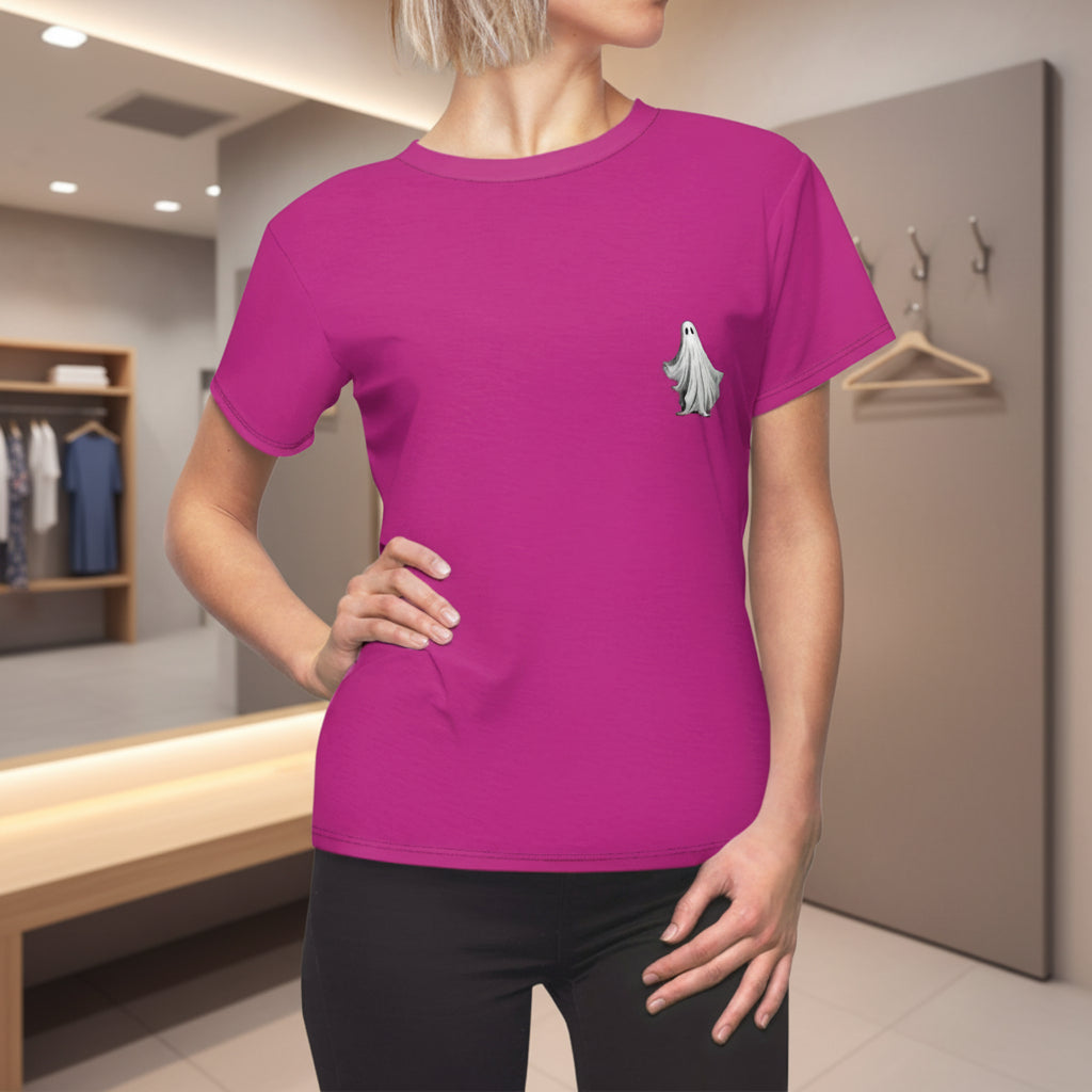 Person wearing a pink t-shirt with a ghost design in a store setting