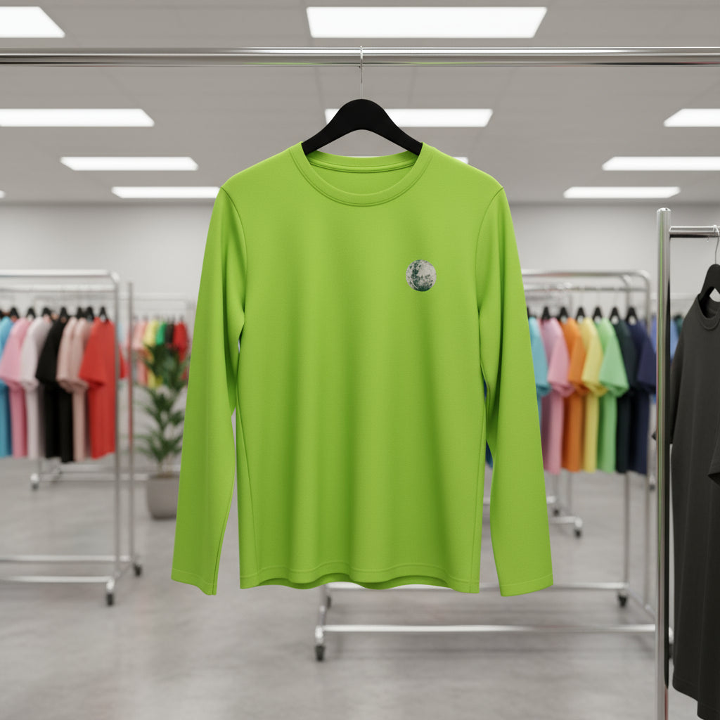 Green long-sleeve shirt on a hanger in a clothing store.