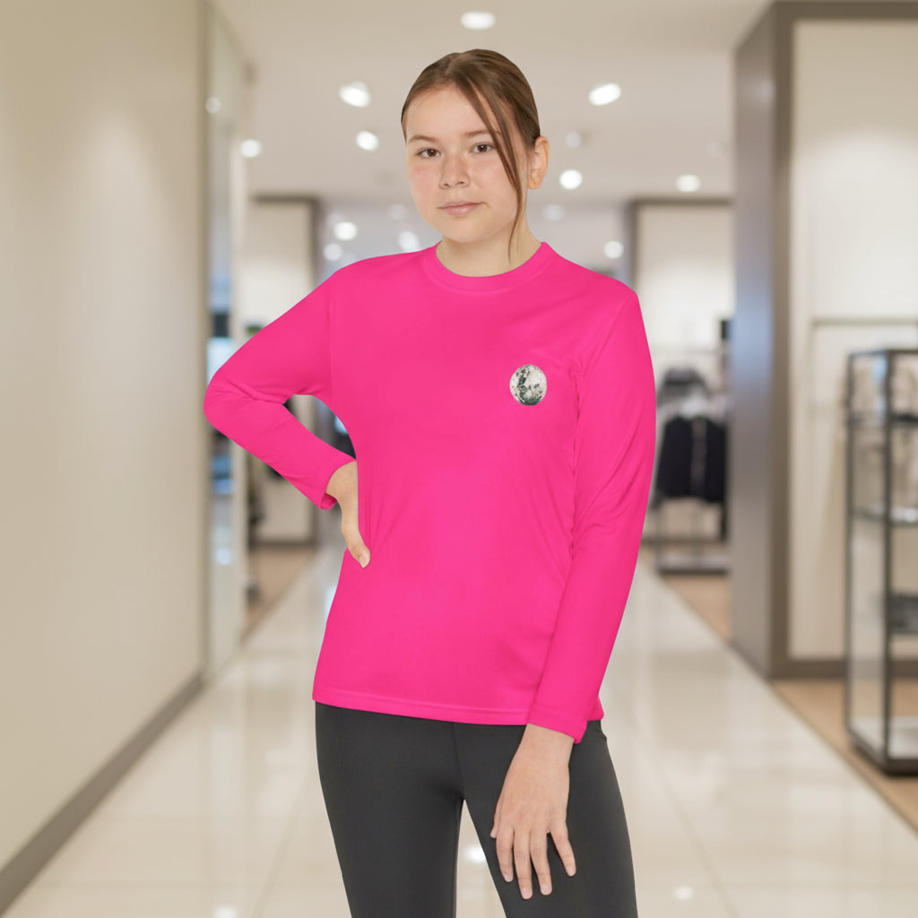 Person wearing a bright pink long-sleeve shirt with a logo in an indoor setting